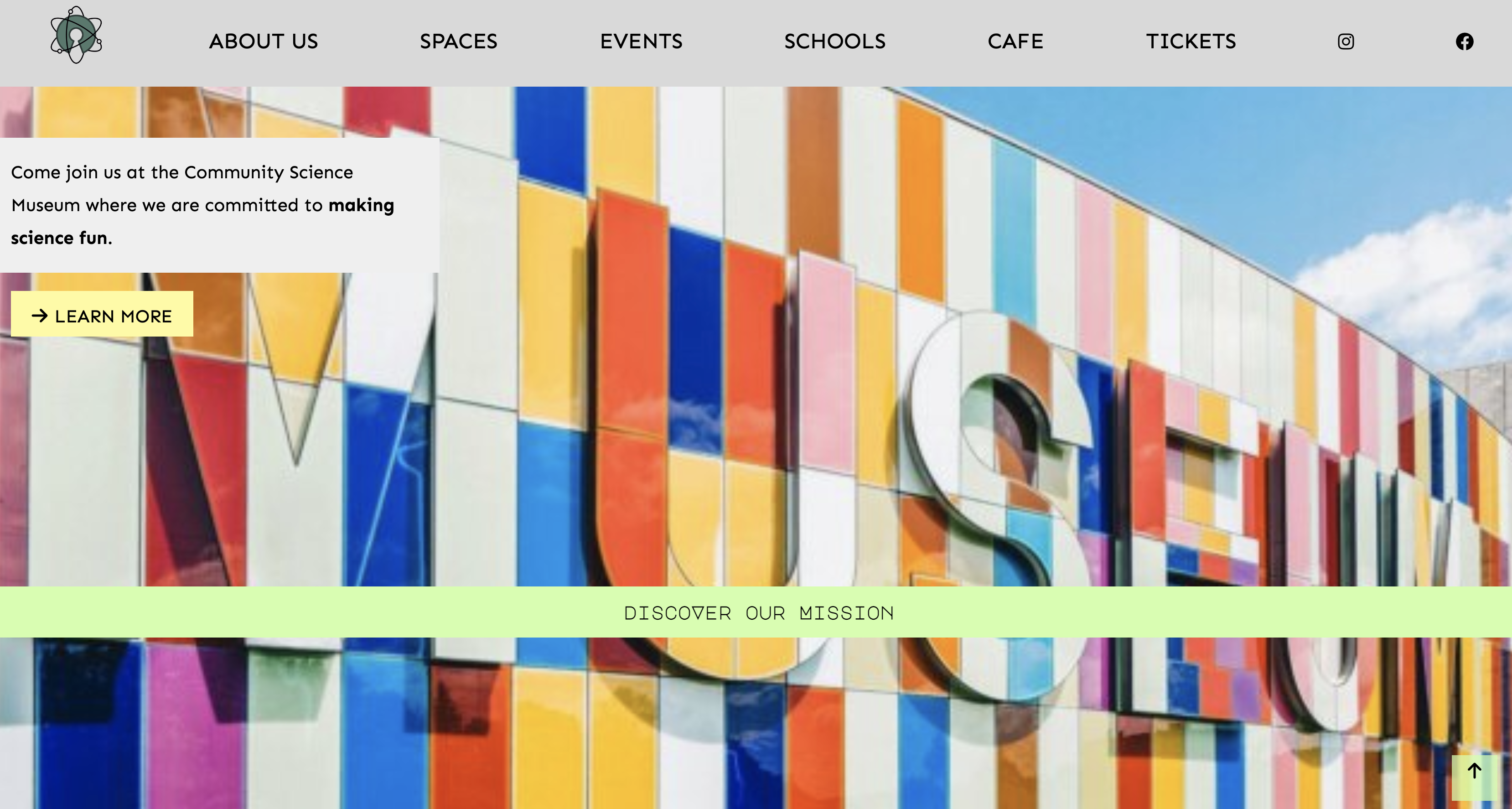 a screenshot of Community Science museum home page showing the building of the museum